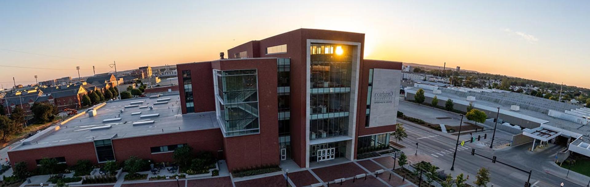 Dental college building with sunrise coming up on the horizon